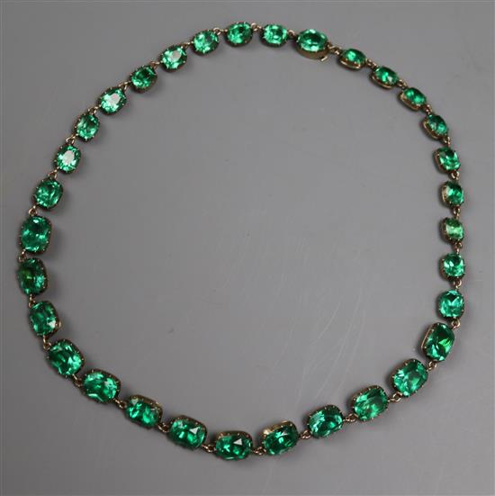 A late Victorian yellow metal and green paste set necklace, 37cm.